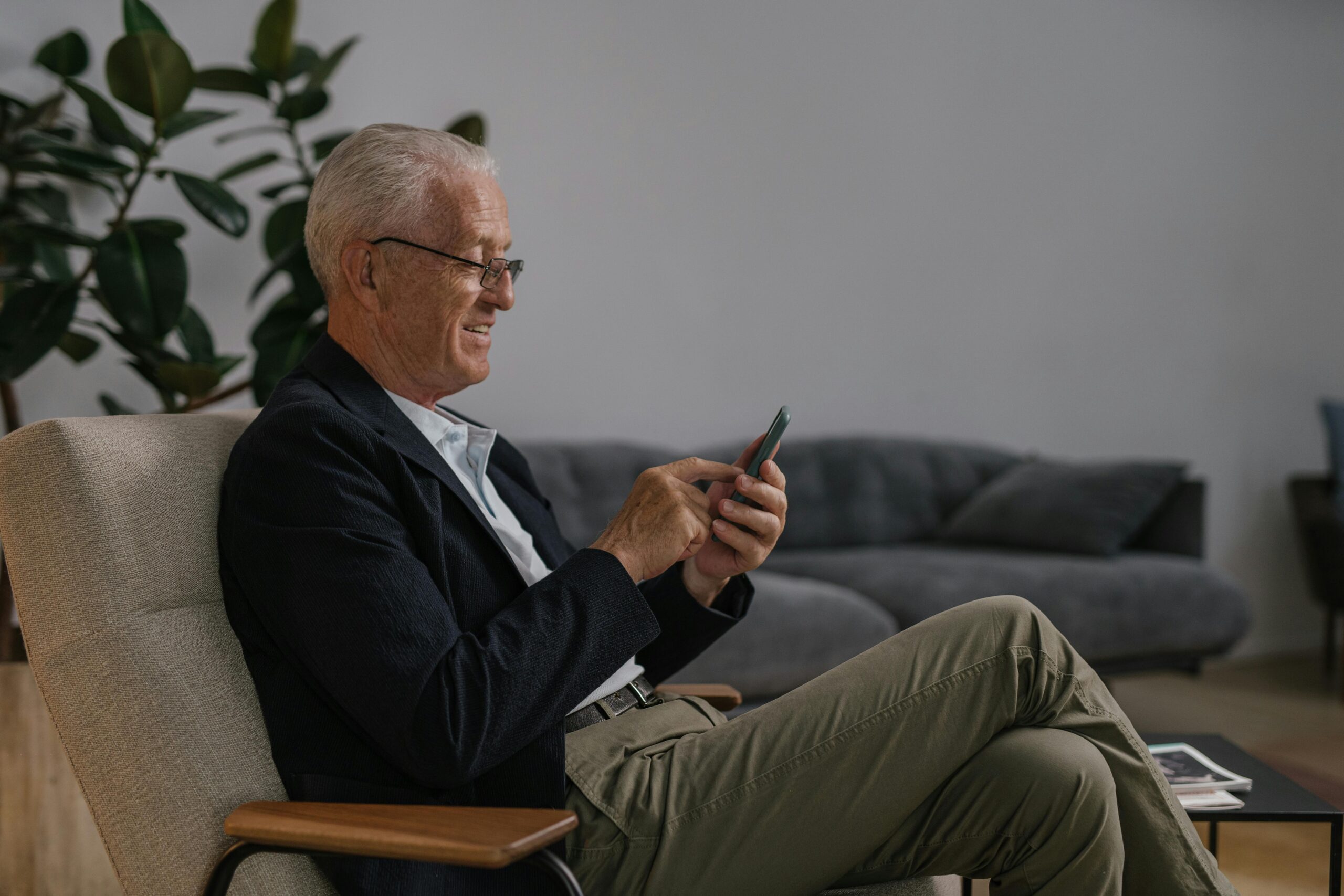 old man scrolling his phone